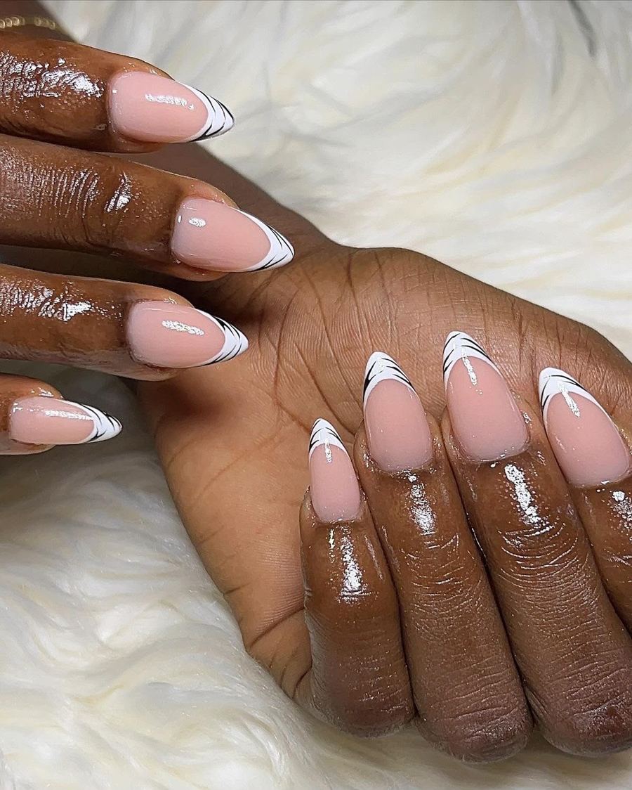 Almond gel nails with white and black French tips