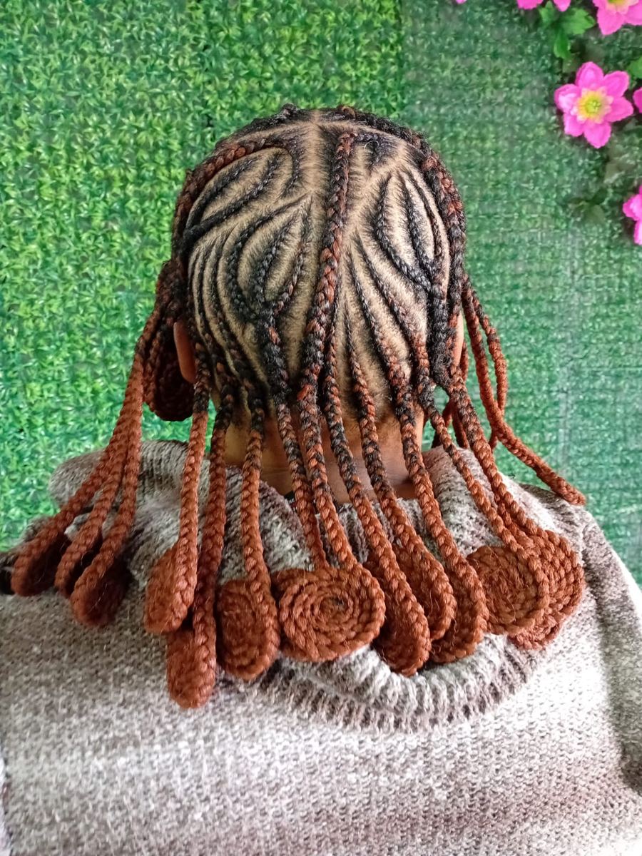 Creative cornrow braids with copper coiled ends